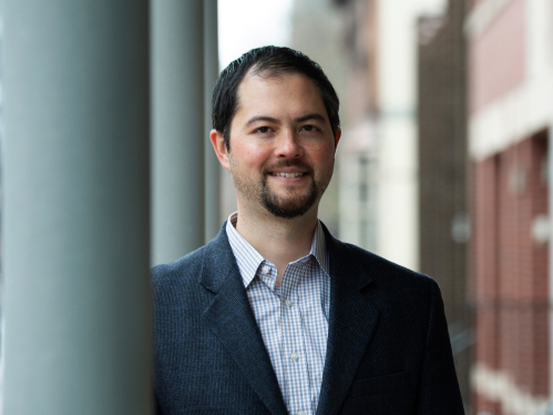 Assistant professor of criminal justice Nathan Link standing in the City of Camden