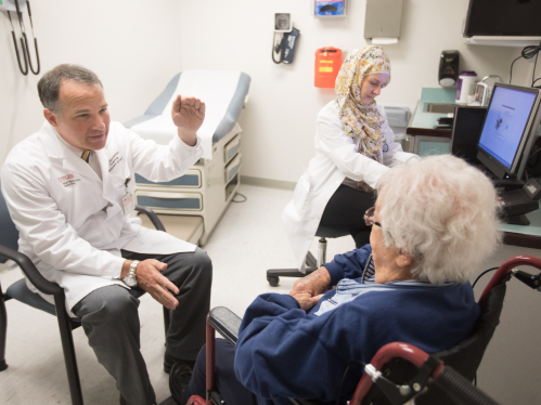 A doctor meets with a patient.