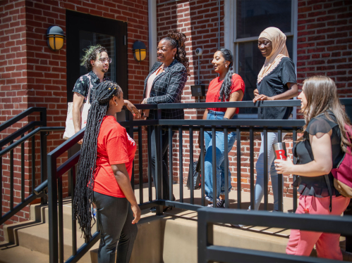 Rutgers Camden graduate school students talking on campus