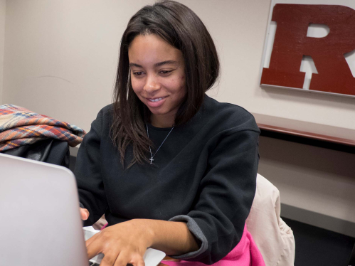 Woman working on a laptop at Rutgers