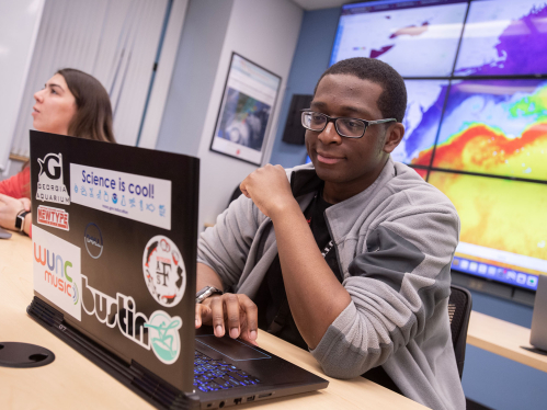 Graduate fellow Teemer Barry works on his laptop in the RU Center for Ocean Observing Leadership Operations Center. 