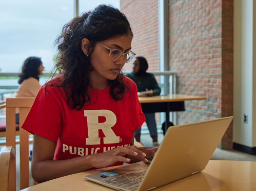 Rutgers school of public health student working on a laptop