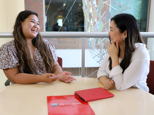 school of public health students sitting at a table