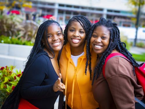 African american female students standing together for a group photo