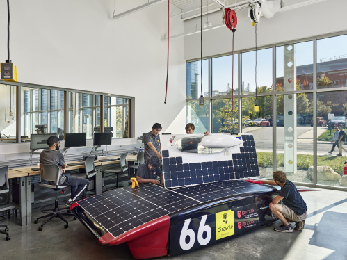 Students building solar race car at the Rutgers student engineering studio