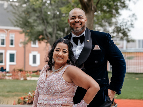 Neela Patel and Phillip Smith smiling outside