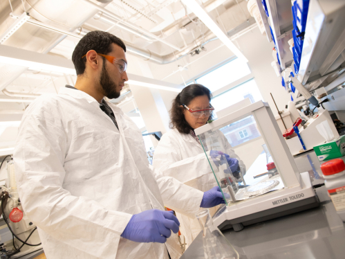 Jing Li and Student in Chemistry Laboratory