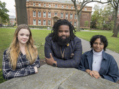 Diversity Peer Educators Brittany Burke (SEBS '23), left, and Ashlee Bonsi (SAS '23), right, flank Darnell Thompson, assistant director of education with the Center for Social Justice Education and LGBT Communities.