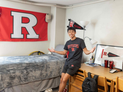 Ethan Thai, 18, moved into his room Wednesday under the spotlight of an NBC television camera crew.
