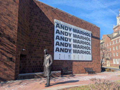 A banner hung outside the Zimmerli Art Museum touts the new Andy Warhol exhibition at Rutgers.