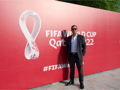 Kenneth Greenblatt infront of World Cup sign
