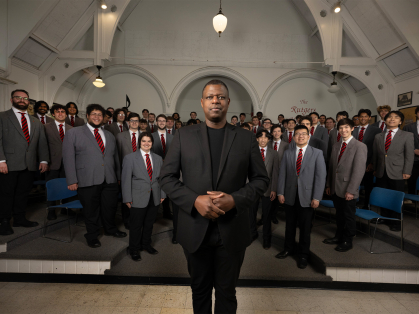 Director Brandon Williams with members of the Glee Club
