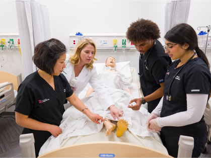 Rutgers school of nursing students practice in class