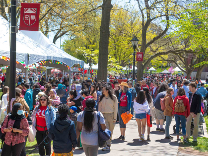Throngs of visitors walk along Voorhees Mall on College Avenue during Rutgers Day 2022.
