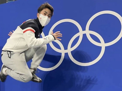 Sydney Chu jumping in the air