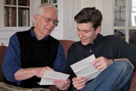 Michael Adas and Joe Gilch examine letters written by a soldier in Vietnam.