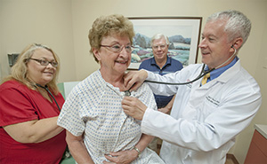 Dr. Alfred Tallia examines Barbara Carcich