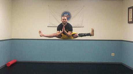 Image of Herman Abuchowski practicing martial arts jump