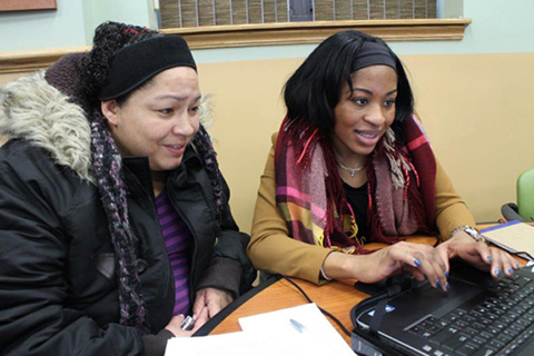 Counselor helping individual enroll in health insurance.