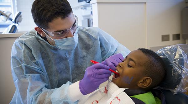Youngster being given dental exam