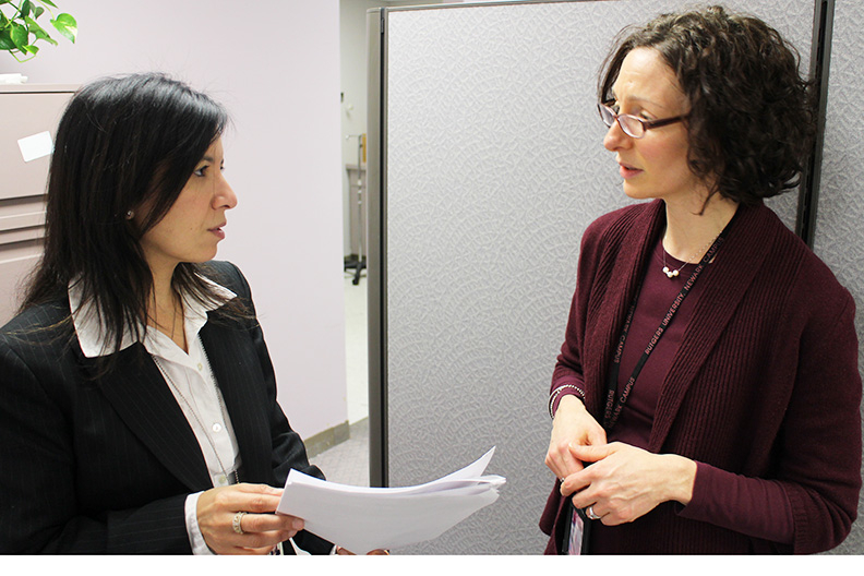 Hanan Tanuos and Jenny N. Rosen Valverde discussing strategies