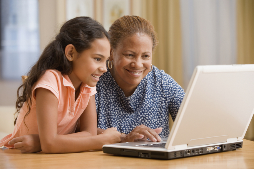 Latino family at laptop