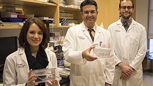 Hatem Sabaawy, center, assistant professor of Medicine and Pharmacology, is flanked by two doctoral students, Stephani Davis, right, and Eric Huselid, left.