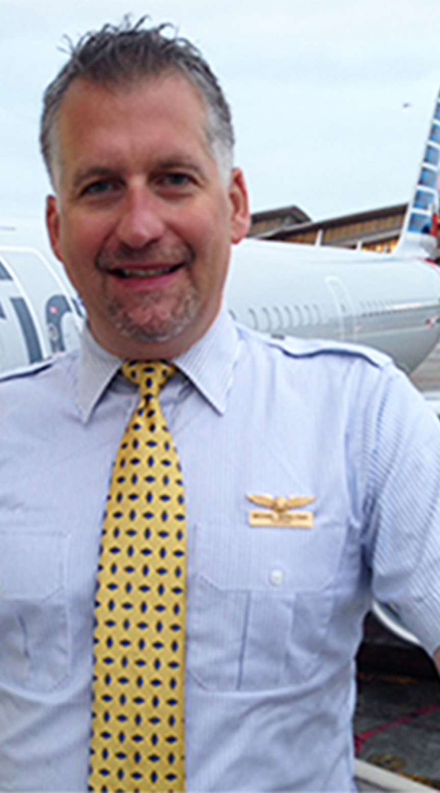 Image of Mike Napolitano in flight attendant uniform.