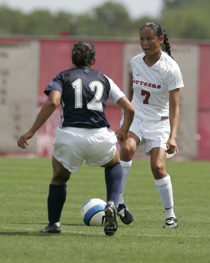 Image of Leia Rispoli against soccer opponent.