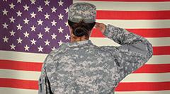 Image of U.S. servicewoman saluting American flag