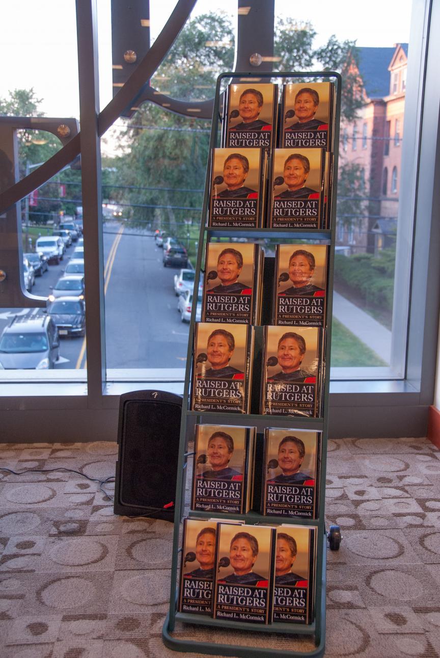 Book rack displays copies of Raised at Rutgers