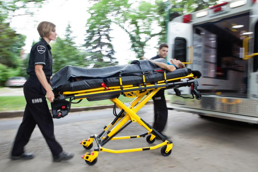 Image of EMS team transporting shooting victim
