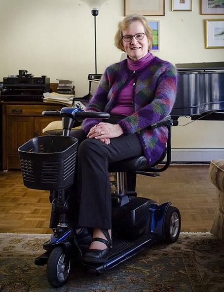 Image of Carolyn Burr on motorized scooter.