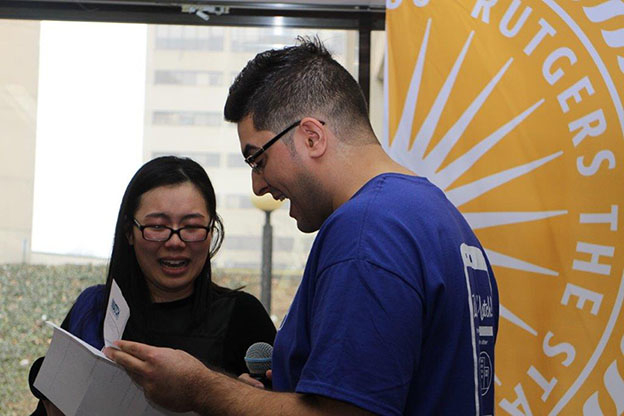 Third-year NJMS medical student Enid Sun tearfully receiving marriage proposal from graduating NJMS student Israel Saramago 