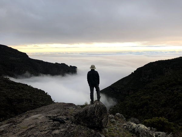 Arsany Makkar atop Mount Kilimanjaro