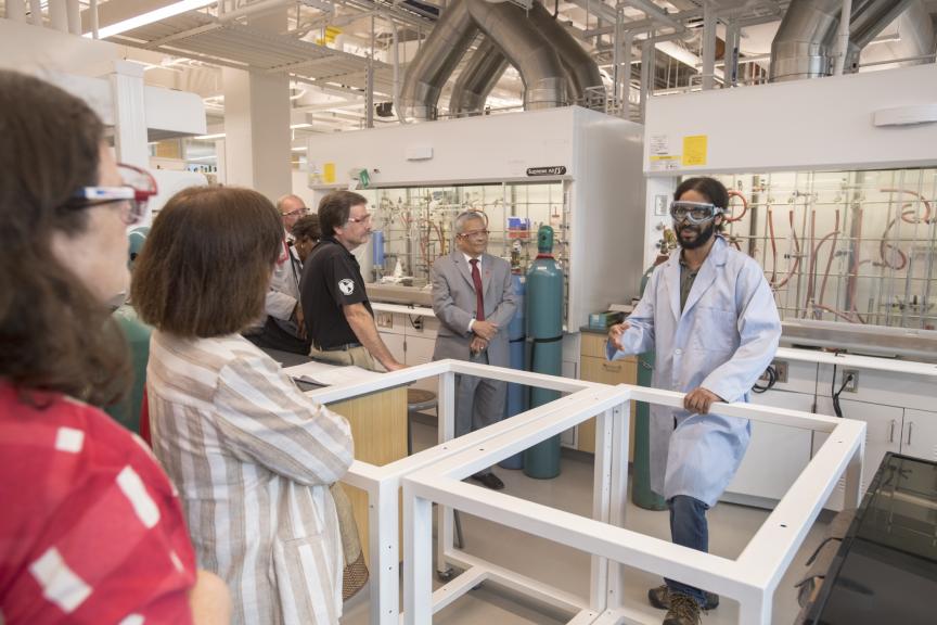 Tariq Bhatti GSNB'21 leads visitors on a tour in the new Chemistry and Chemical Biology building 