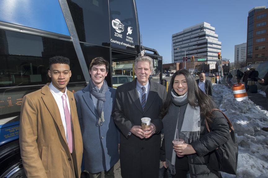 RUSA representative Marc Younker, RUSA Legislative Affairs Chair Julien Rosenbloom, U.S. Rep. Frank Pallone and RUSA President Suzanne Link board a Megabus in New Brunswick for their mobile town hall to Capital City.