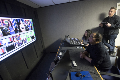 Alice Hernandez (SMLR'18), from right, Executive Series Producer William Sanchez (NCAS '76) and Assistant Director Neal Bennett (GSE '19) working in control room for Images/Imagenes taping. 