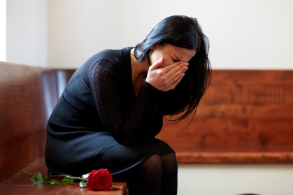 Woman grieving alone.