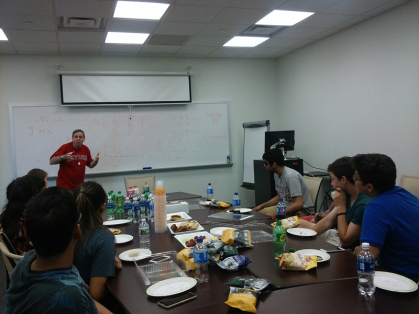 Rutgers philosophy professor Larry Temkin leads Edison High School philosophy club in discussion.