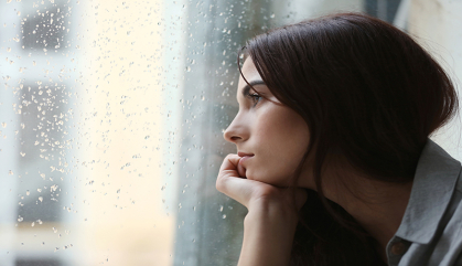 A woman looking out the window