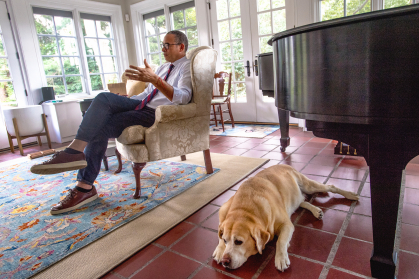 Holloway with pet dog at the presidents residence