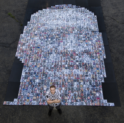Alex Scoloveno standing with oversized mosaic of George Floyd