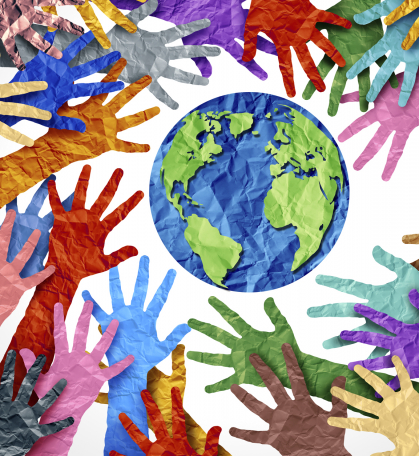 Multi color paper cut-out hands reaching towards the world globe