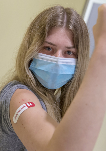 Junior Jordan K. Clavida the first student to receive a COVID-19 vaccination