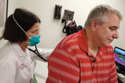 Physician Iris Udasin attends to former Piscataway, New Jersey, firefighter Frank Geffre.