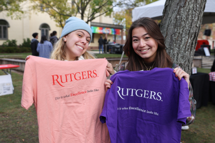 Two students show off Excellence Fest T-shirts.