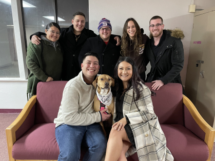 Alexandra Rodriguez and Salvatore Liguori alongside their family members inside of Metzger Hall following the proposal