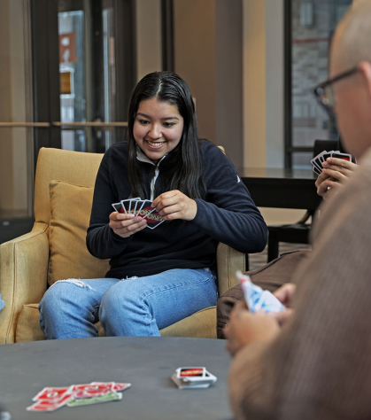 Honors College student Samantha Torres smiles during a round of Uno.