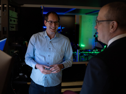 Two men standing in a lab